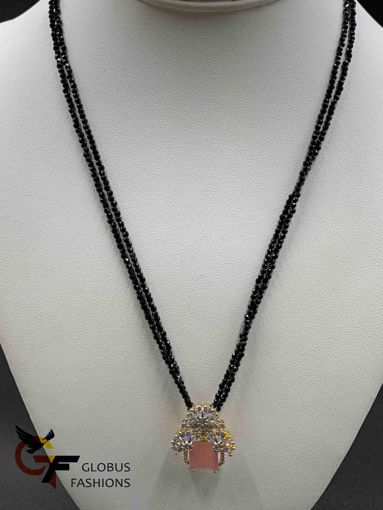 Black beads with cz stones and pink stone pendant