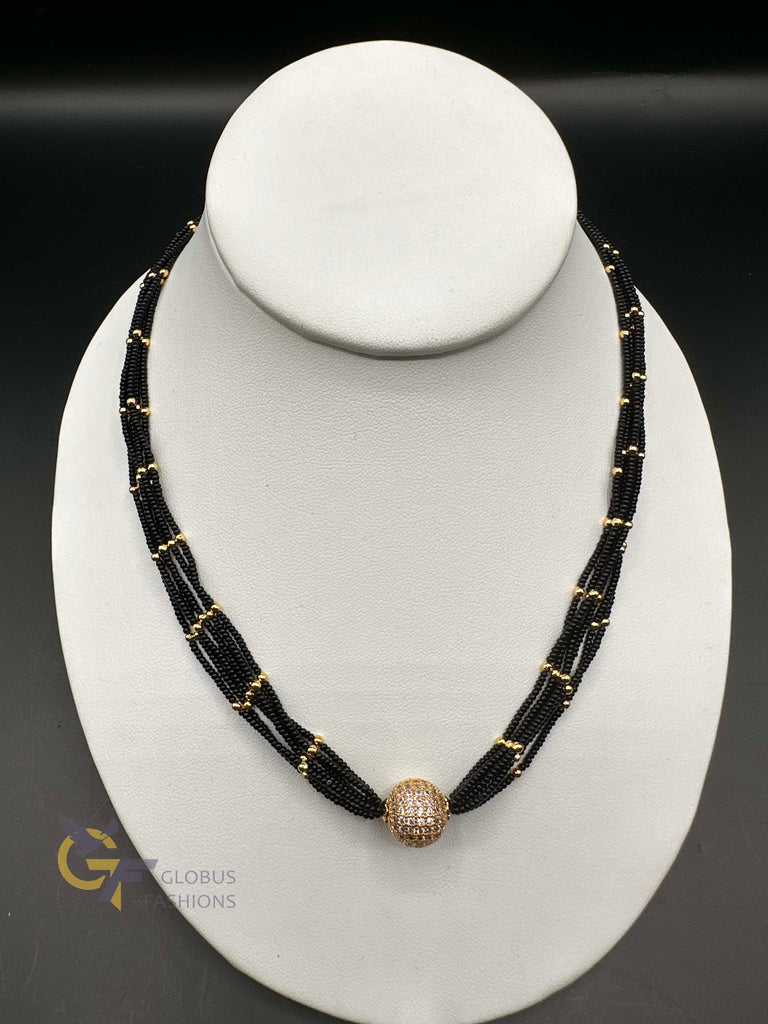 A bunch of soft black beads chain with CZ Stones ball pendant