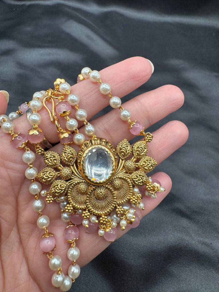 Pearls and pink beads chain with antique lotus pendant with matching jumka earrings