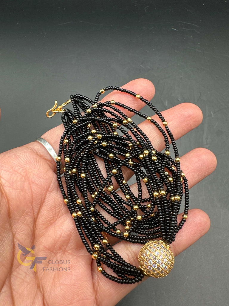 A bunch of soft black beads chain with CZ Stones ball pendant