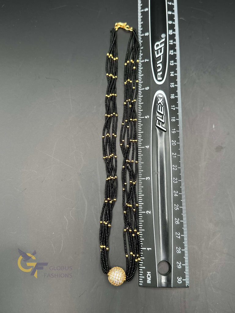 A bunch of soft black beads chain with CZ Stones ball pendant