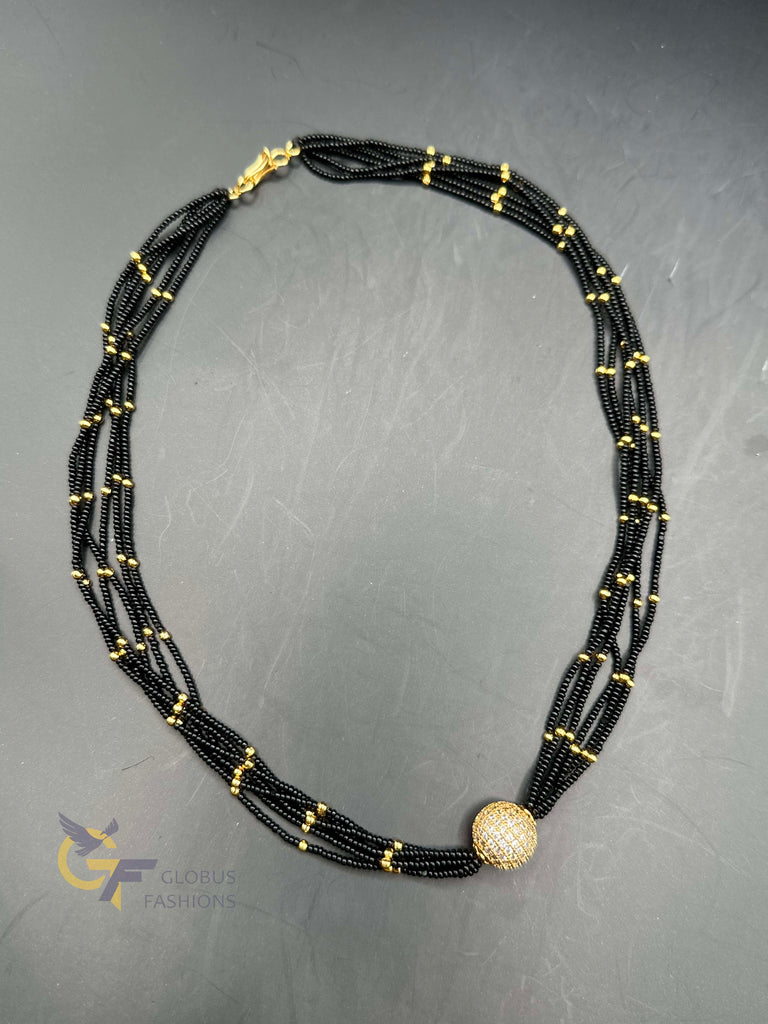 A bunch of soft black beads chain with CZ Stones ball pendant