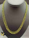 Bunch of green crystal beads twisted with gold chains