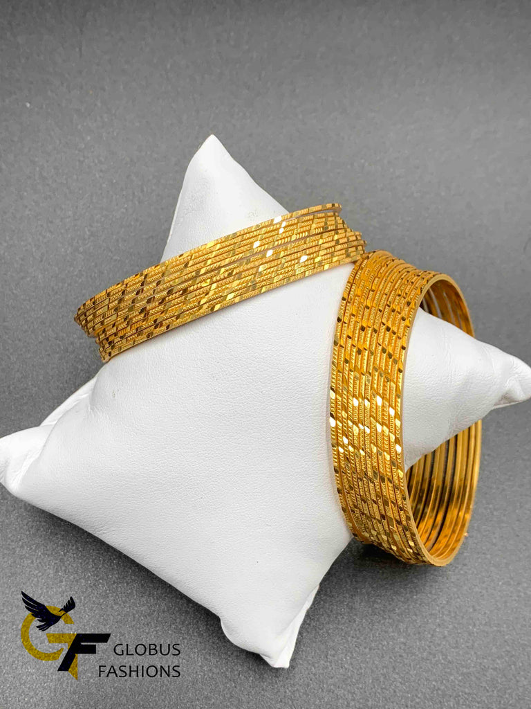Set of 24 gold self design bangles