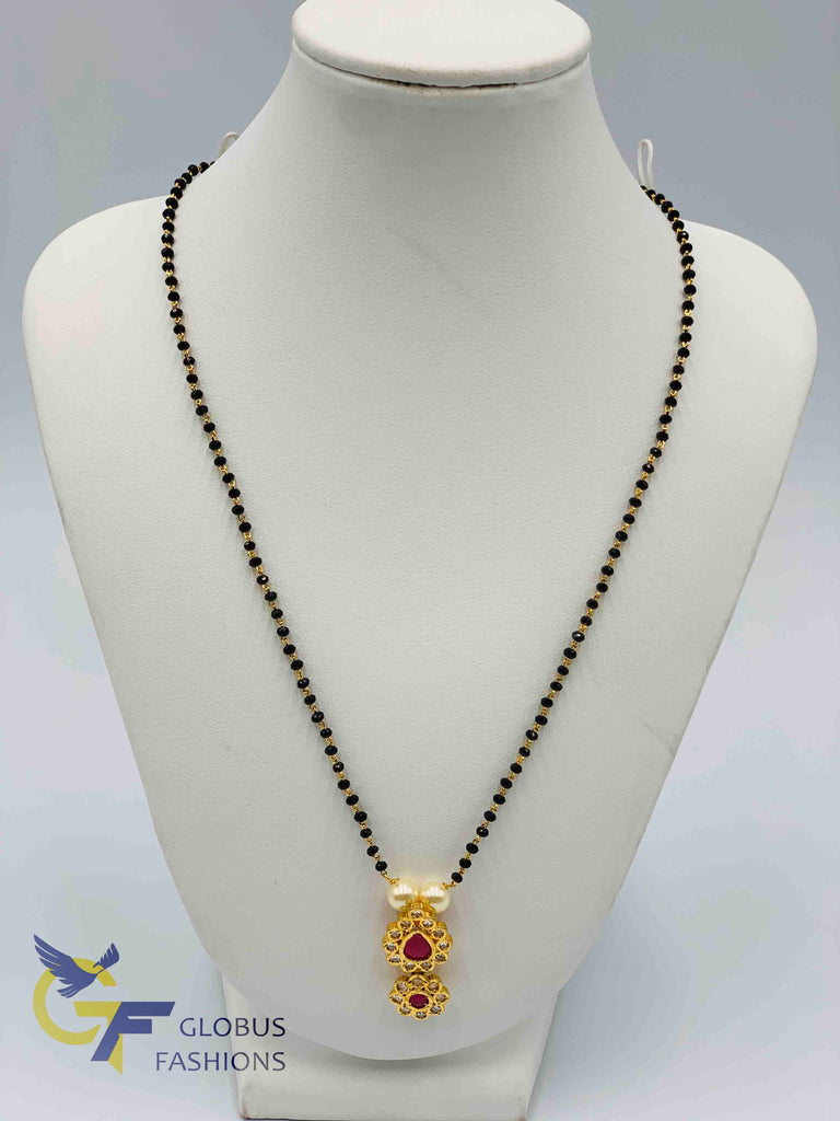 Uncut cz stones with ruby stones pendant with a single line black beads chain