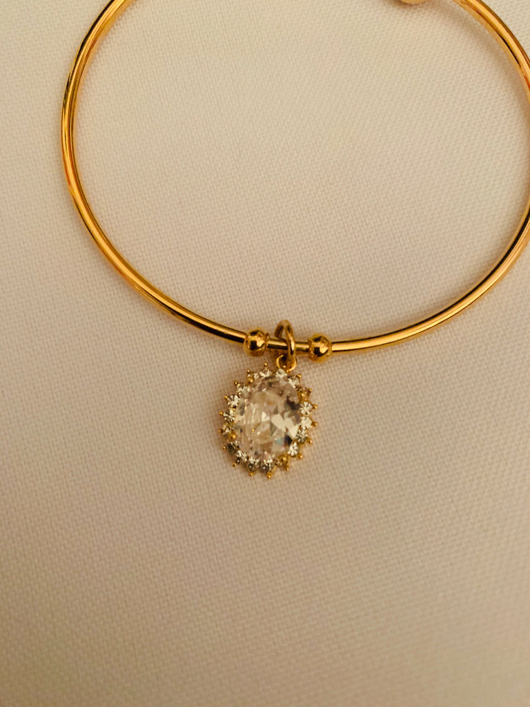 Cz stones locket with gold kada bracelet