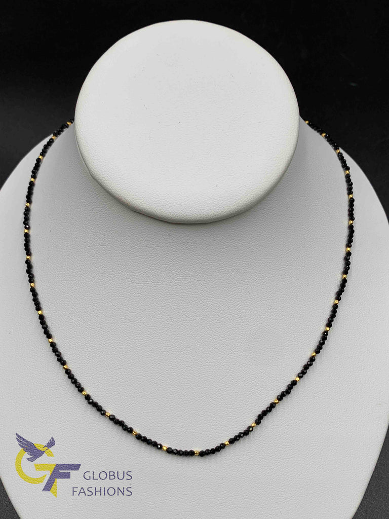 Small gold beads with black beads chain
