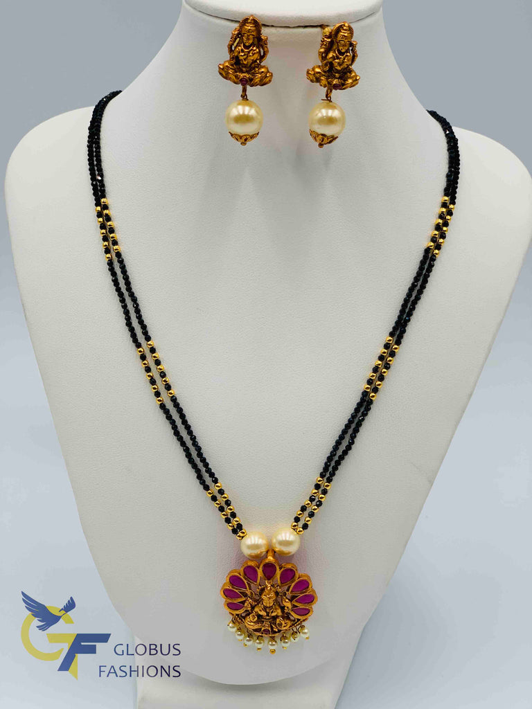 Traditional and antique look Lakshmi print with ruby and pearls pendant set with black diamond beads chain