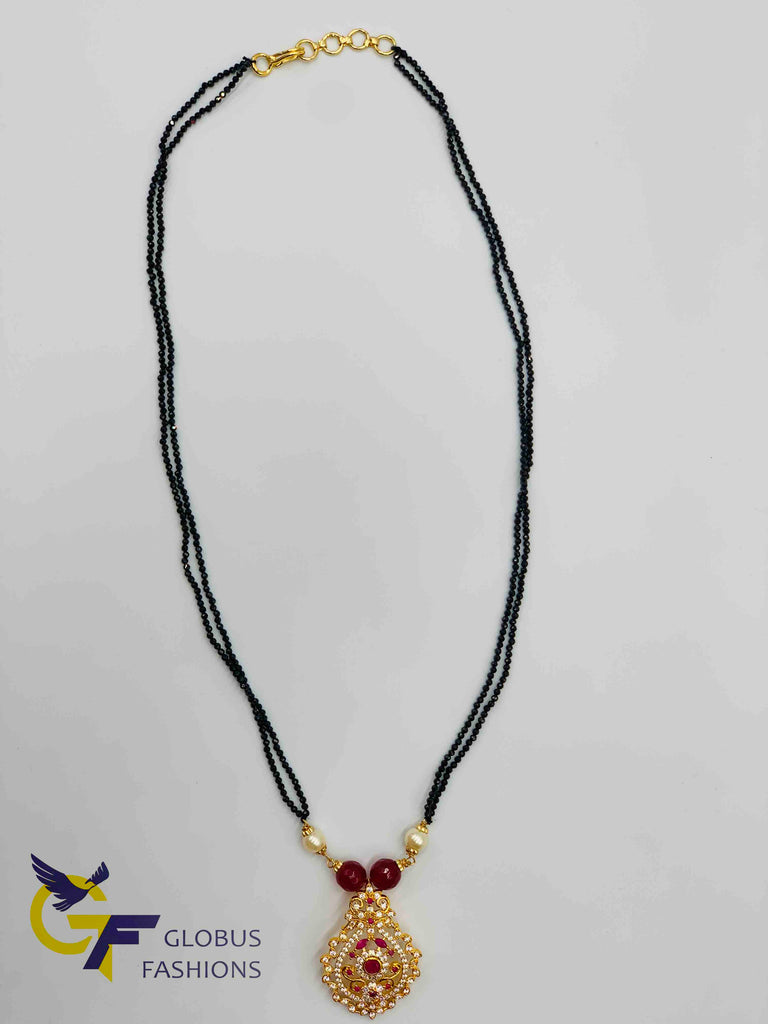 Cz stones and ruby stones pendant with black diamond beads chain