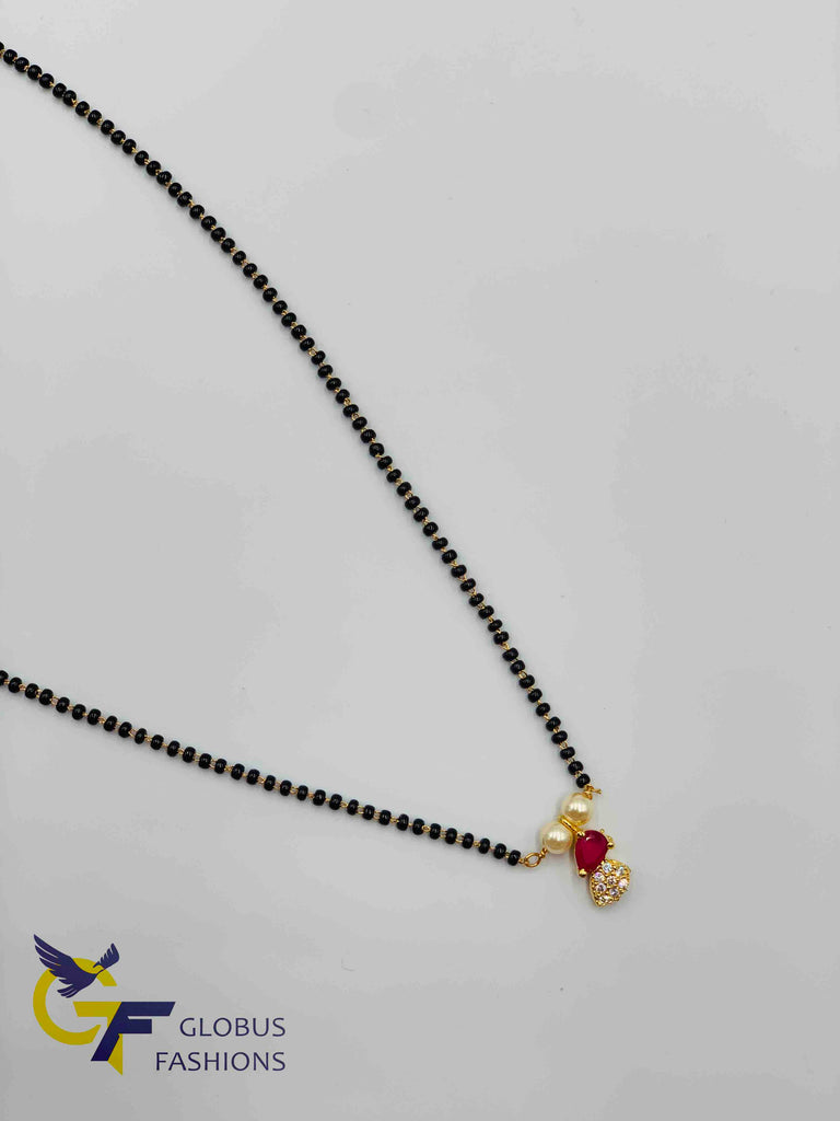 Small cz and ruby stones pendant with a single line black beads chain