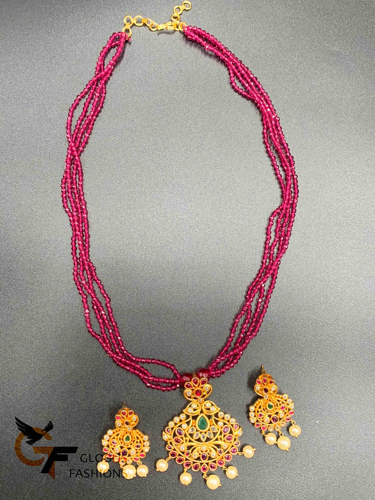 Pink color beads with a traditional and antique look multi-color stones pendant and matching earrings