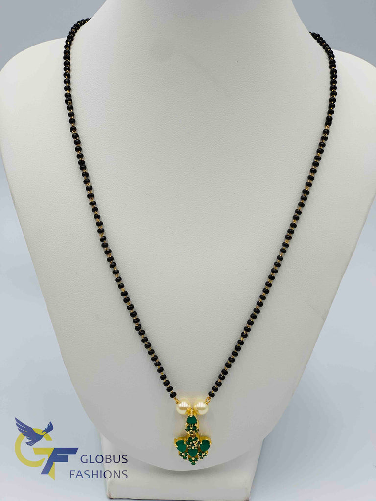 Emerald stones pendant with a single line black beads chain