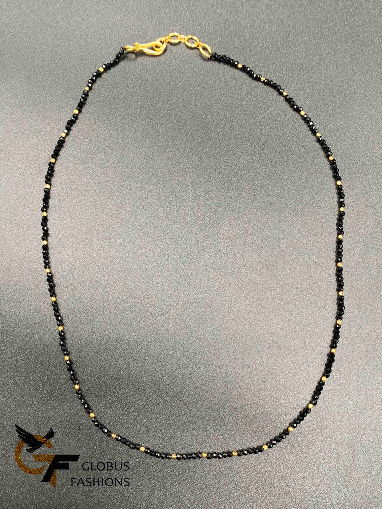Small gold beads with black beads chain