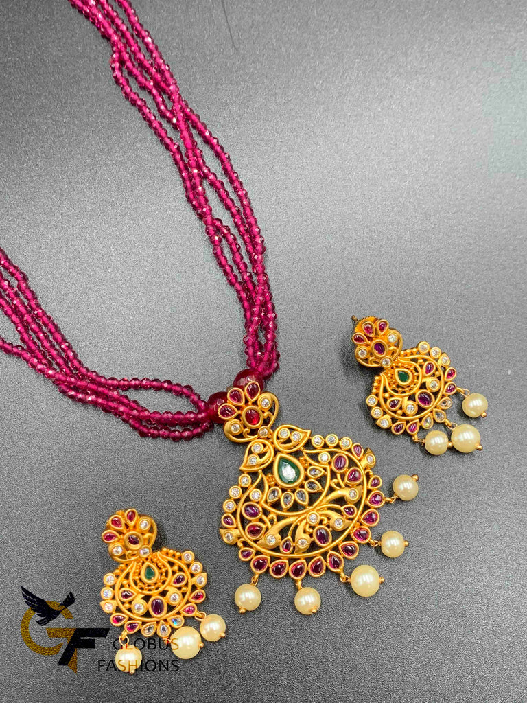 Pink color beads with a traditional and antique look multi-color stones pendant and matching earrings